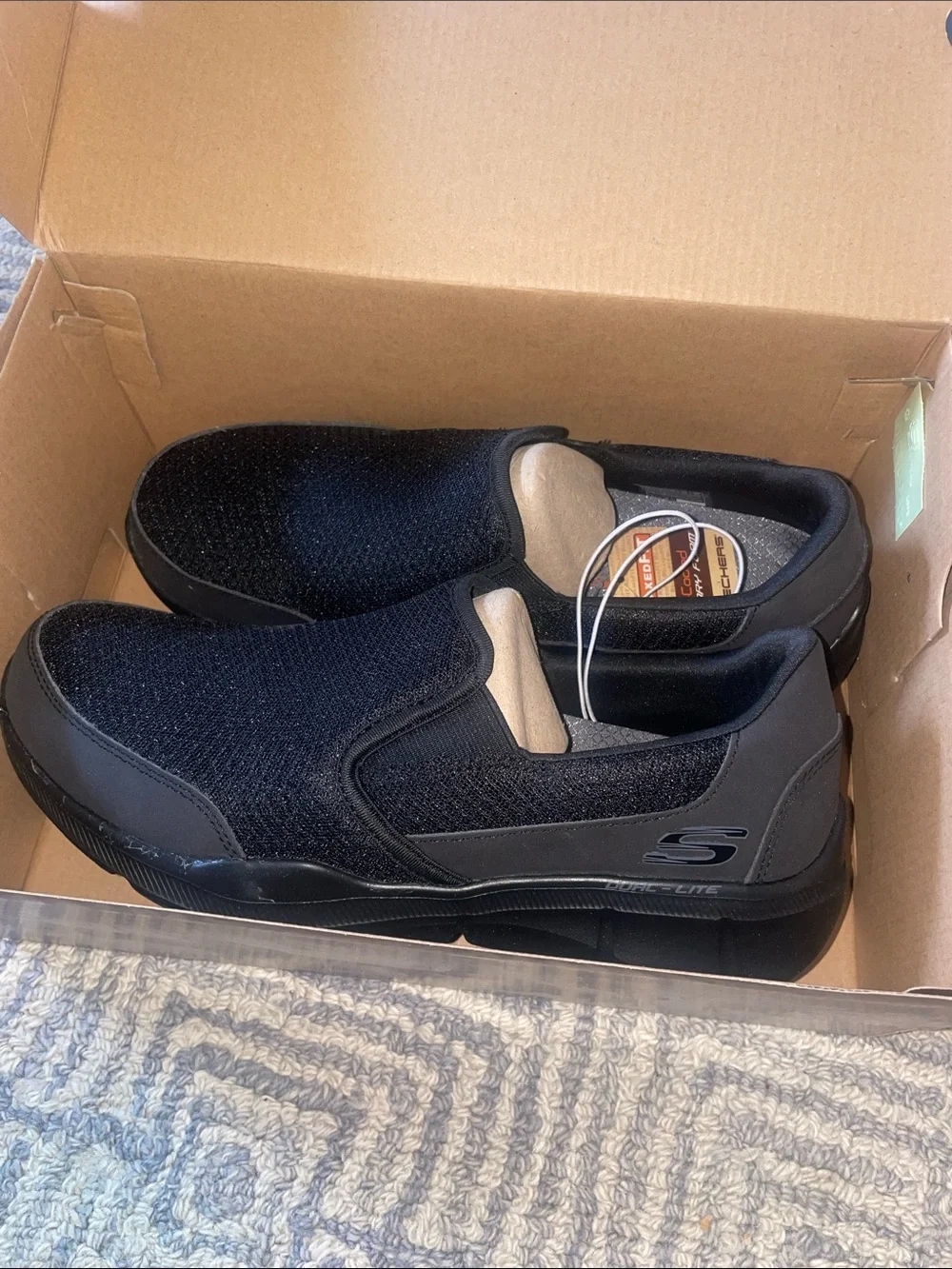 BNIB Skechers Black Slip-On Air cooled Memory Foam footbed loafers, size 9